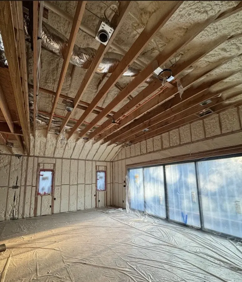 Interior walls and ceiling insulated with spray foam during new construction in Massac